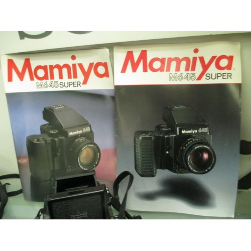 344 - Mamiya M645 100S camera with accessories, user manuals, leather case, etc