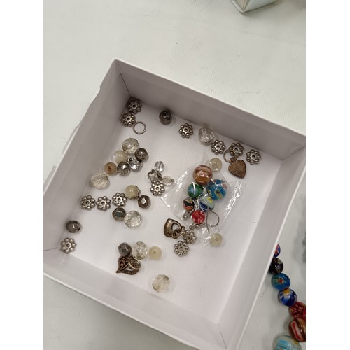 250 - A box of various Moroni beads