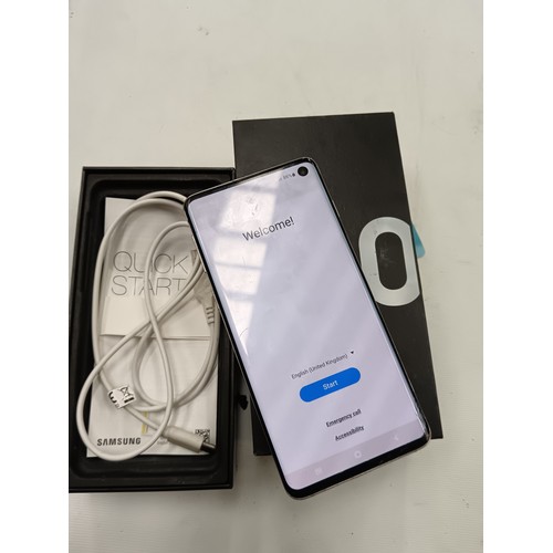 281 - Samsung galaxy S10 in original box in working order has a slight crack on lower screen & on back (se... 