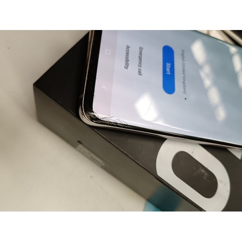 281 - Samsung galaxy S10 in original box in working order has a slight crack on lower screen & on back (se... 