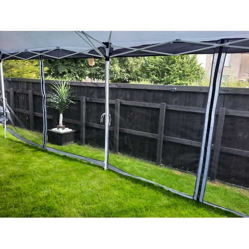 600 - Large pop up Gazebo with netted side panels - 6m x 3m