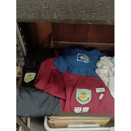 22 - Quantity of assorted Burnley F.C. T-shirts and jackets size L & M