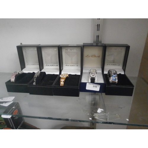 316 - Five assorted boxed watches