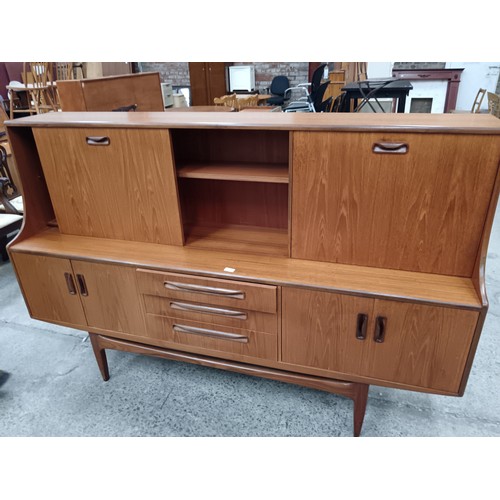 694 - A G-PLAN cocktail highboard