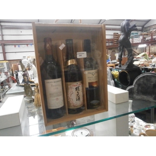 345 - Display case with three assorted wines