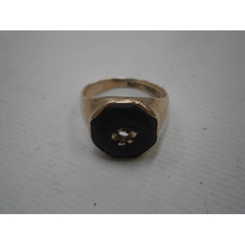 226 - 9CT gold hallmarked ring with black stone, weight 4.35 grams