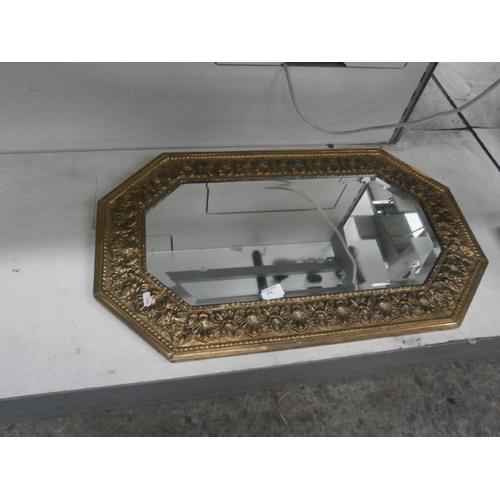 370 - Ornate brass framed bevel edged mirror