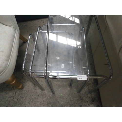 610 - A nest of 3 x metal framed glass top occasional tables