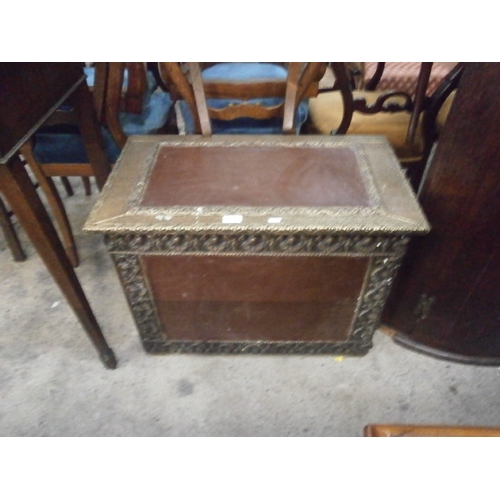 721 - A small vintage storage box with leather panels and decorative brass edging