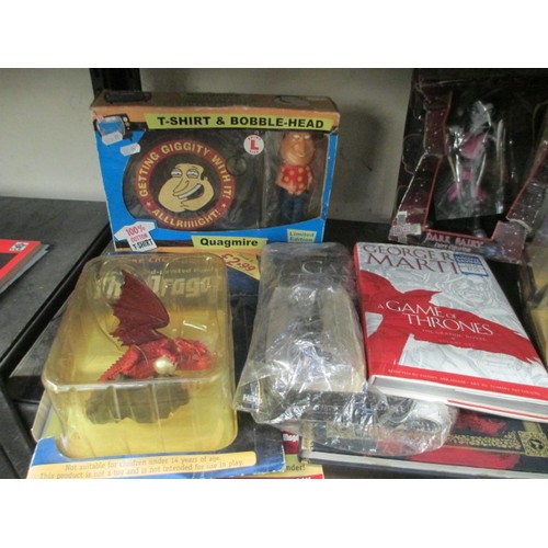 55 - Lot inc Game of Thrones books, Golden Compass toys, dragon, etc