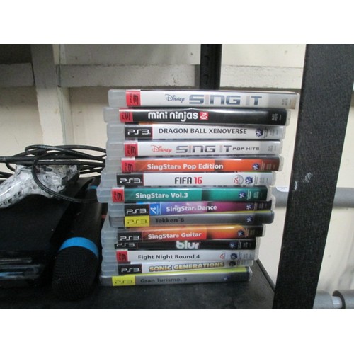 109 - PS3 with selection of games and two controllers and Singstar microphones. Working just needs an upda... 