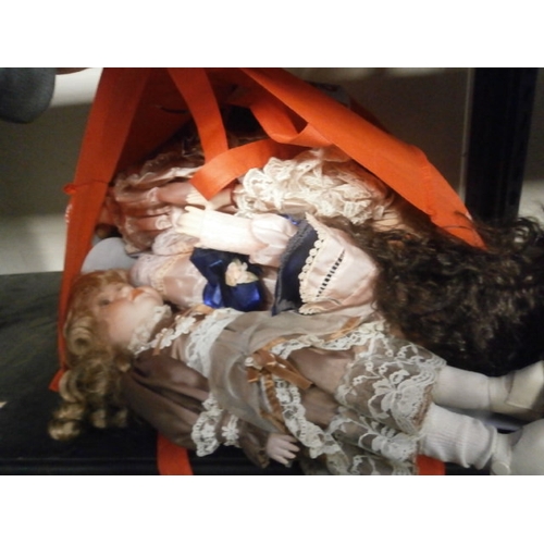 68 - Bag of assorted porcelain dolls