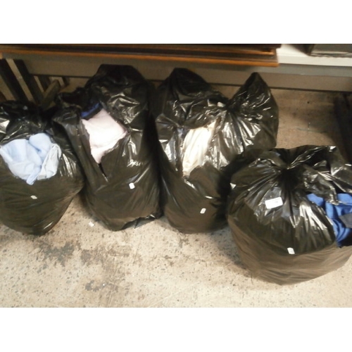 186 - Four bags of assorted clothing