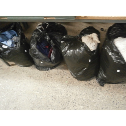 282 - Four bags of assorted clothing