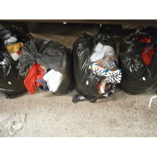 283 - Four bags of assorted clothing