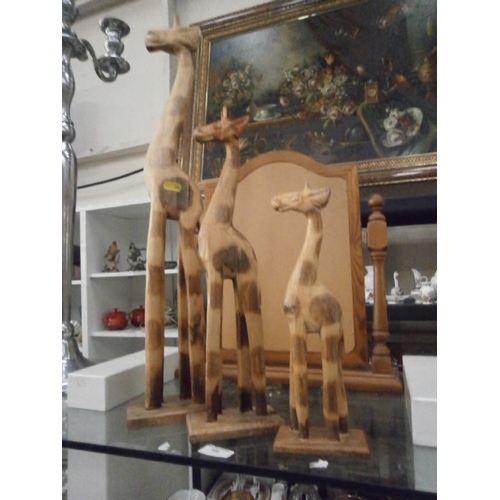 389 - Three wooden Giraffe ornaments