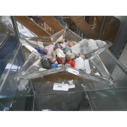 299 - Glass star shaped bowl containing gem stones