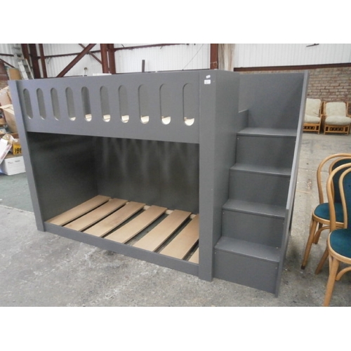 600 - A wooden bunk bed unit with fitted staircase