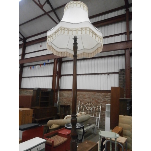 627 - A vintage standard lamp with shade