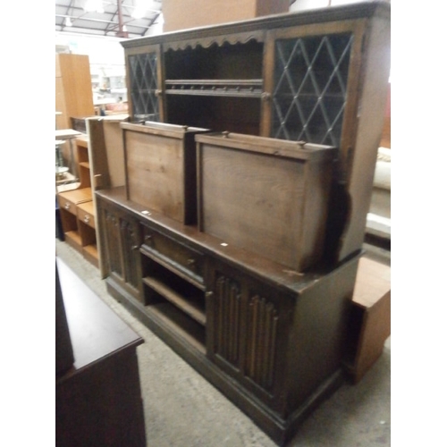 631 - A large vintage 3 drawer lenenfold dresser with lead glazed cabinets