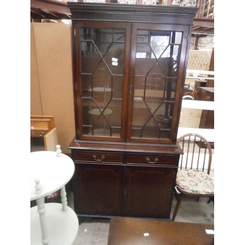 636 - A vintage inlaid mahogany glazed bookcase on 2 drawer cupboard base