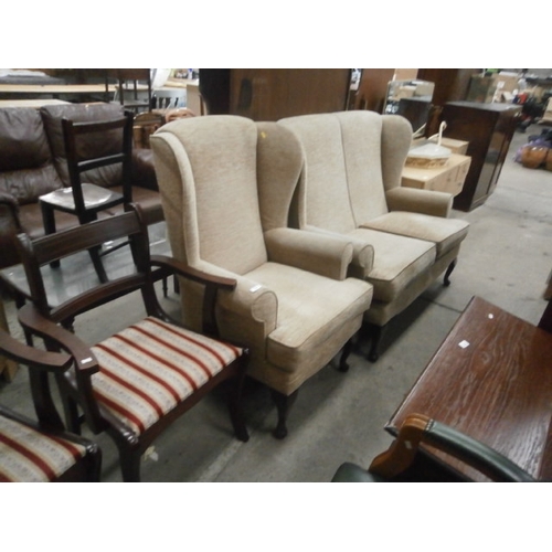 648 - A vintage upholstered wing back 2 seater settee and matching armchair