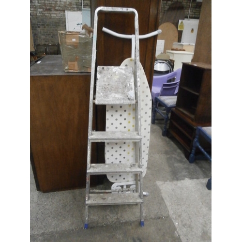 651 - A set of aluminium step ladders and an ironing board