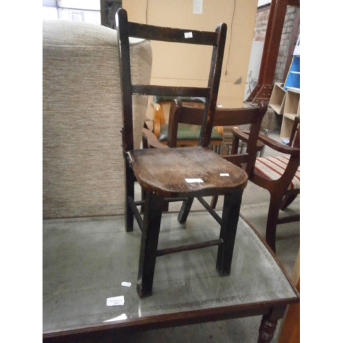 656 - A child's vintage wooden chair