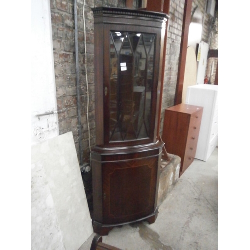 660 - A vintage glazed mahogany corner cabinet