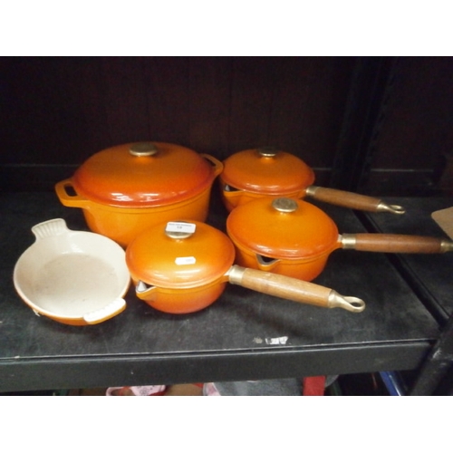 19 - Four lidded cast iron pots and dish