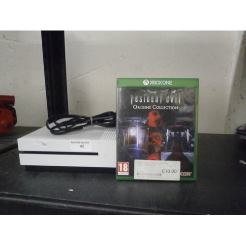 42 - Xbox one s with Resident Evil game powers up when plugged in