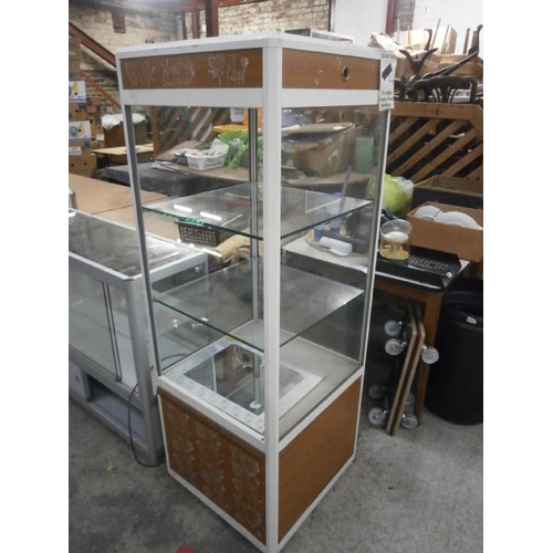 692 - A large glazed display cabinet. Dimensions H64.5