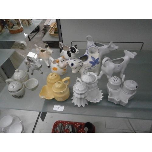 335 - Lot inc cruet sets and novelty cows jugs