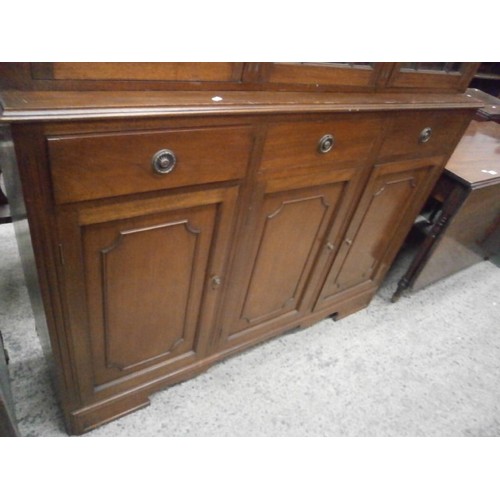 604 - A large antique glazed mahogany bookcase unit on 3 drawer base