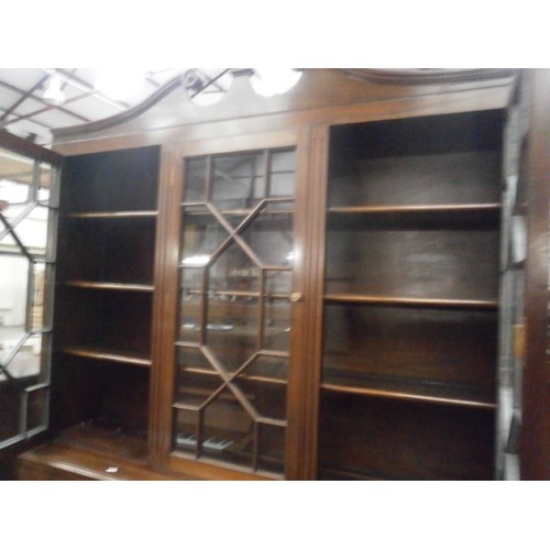 604 - A large antique glazed mahogany bookcase unit on 3 drawer base