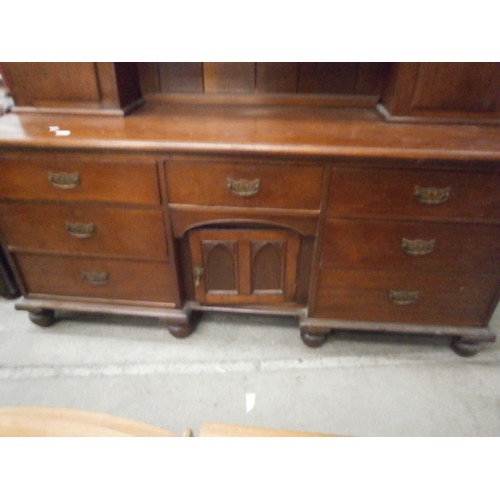 665 - A large vintage mahogany dresser on 7 drawer base