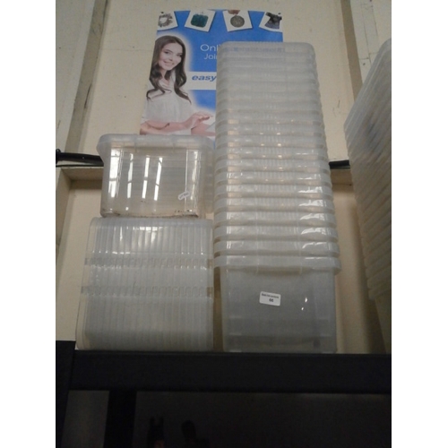 66 - Twenty plastic storage tubs with lids