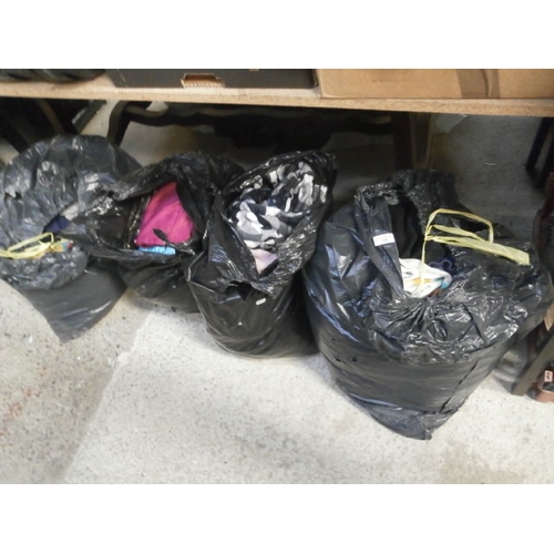 132 - Four bags of assorted clothing