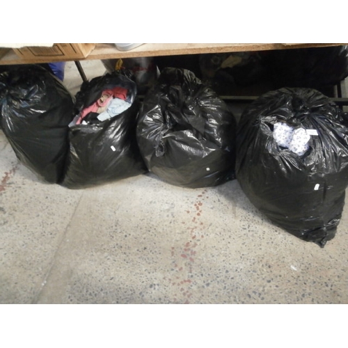 133 - Four bags of assorted clothing