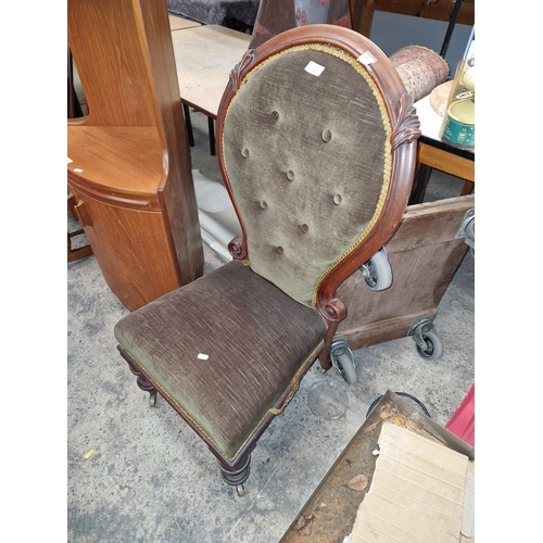 718 - Vintage cushioned chair on castors