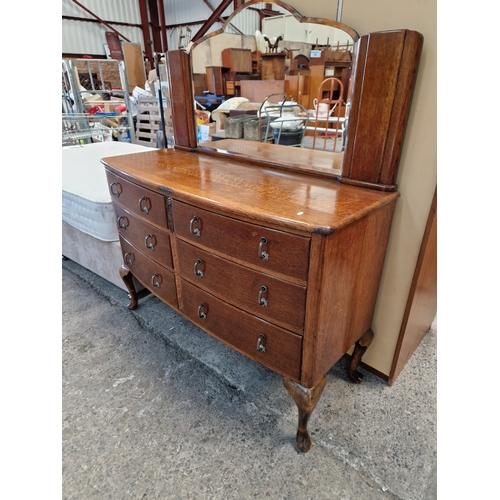 722 - Ornate bow fronted mirror back sideboard