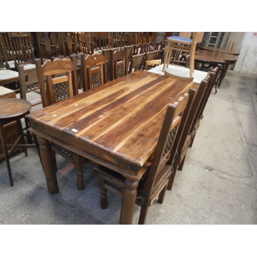 676 - A large Sheesham style dining table and 6 x matching chairs