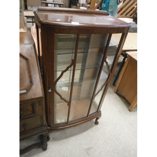 713 - Bow fronted glass display cabinet with shelves and key