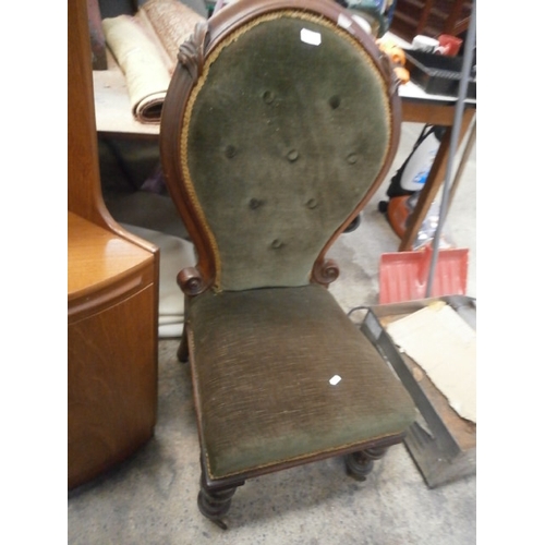 718 - Vintage cushioned chair on castors