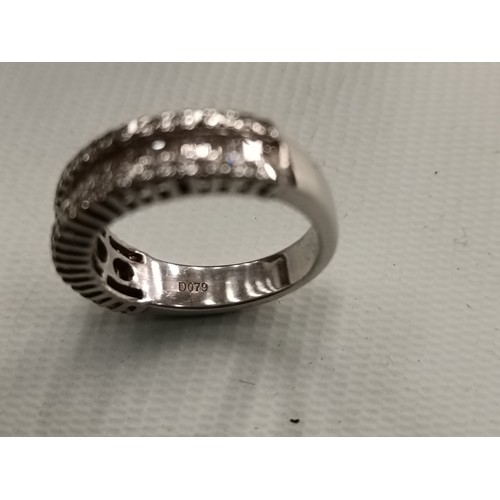 205 - 18ct white gold and diamond D079 ring with serial number 855895, tested at jewellers.