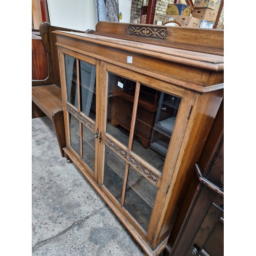 618 - A large glazed vintage bookcase