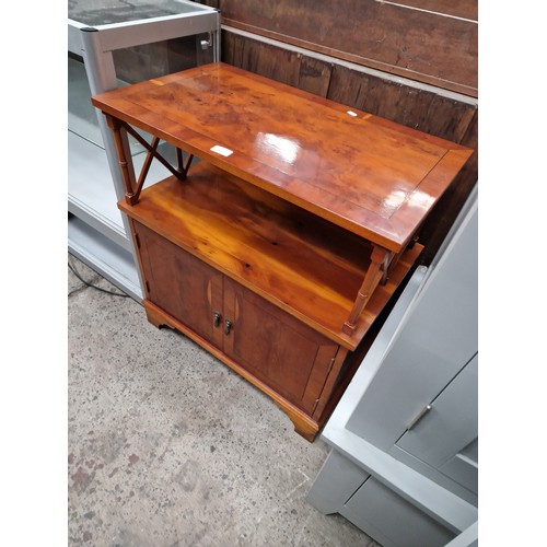 623 - A small 2 tier table stand on 2 door cupboard