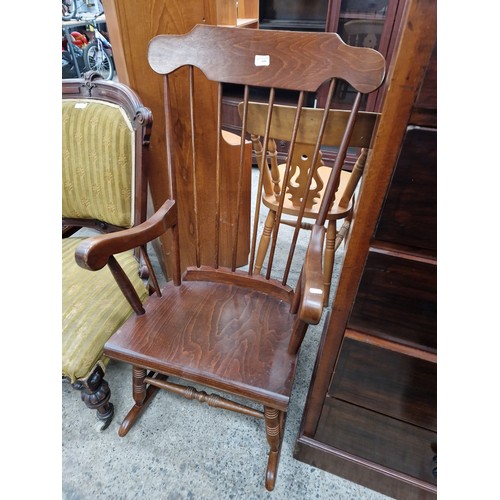 626 - A vintage spindle backed wooden rocking chair