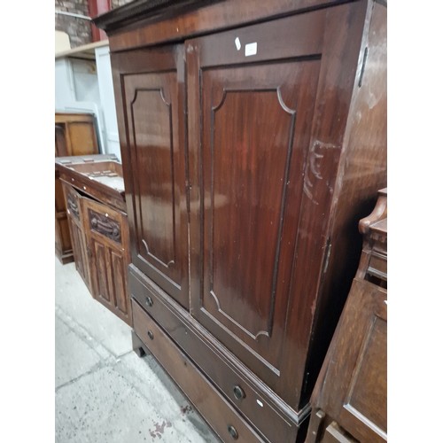 632 - A vintage mahogany 2 door wardrobe with one lower drawer