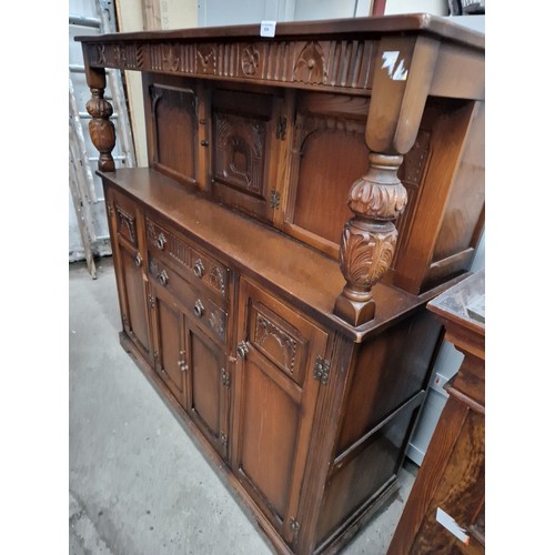 634 - A large ornately carved vintage 2 drawer court cupboard